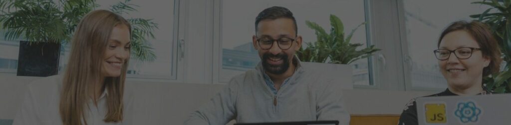 Man and two woman working together