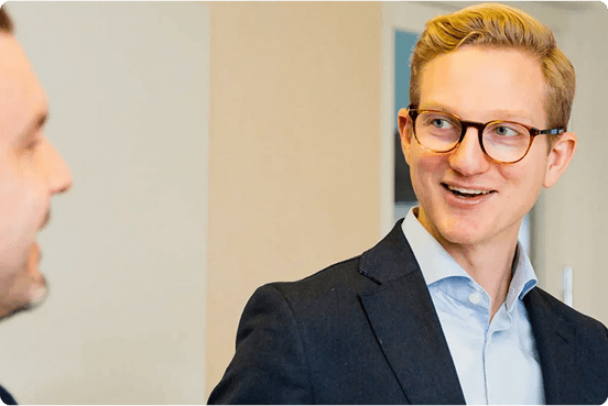 man with glasses smiling