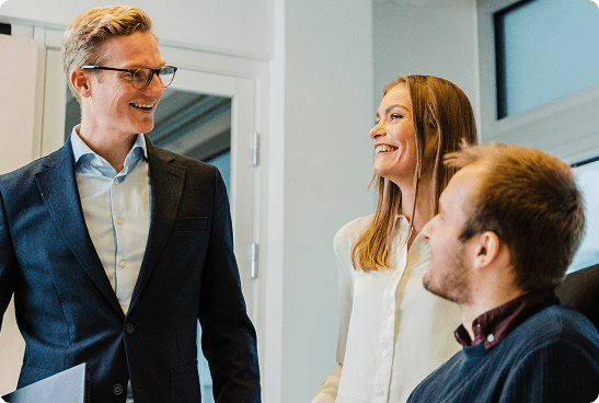 two men having a conversation with a woman