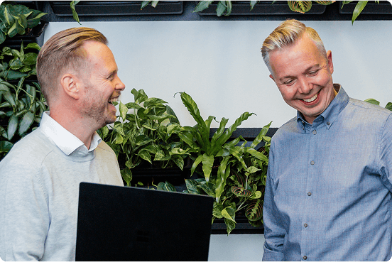 two person with laptop